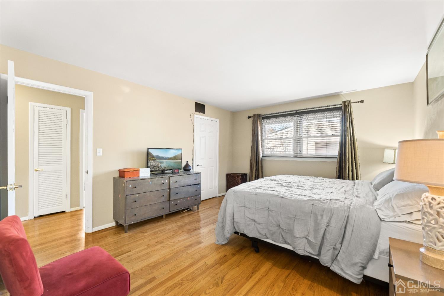 50 Wilk Road Edison, NJ 08837 - Photo 23 of 27 a bedroom with a bed and a couch