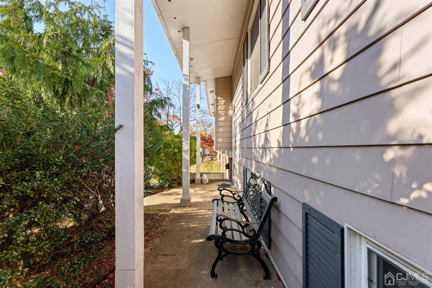 50 Wilk Road Edison, NJ 08837 - Photo 5 of 27 a view of balcony with chairs and iron gate