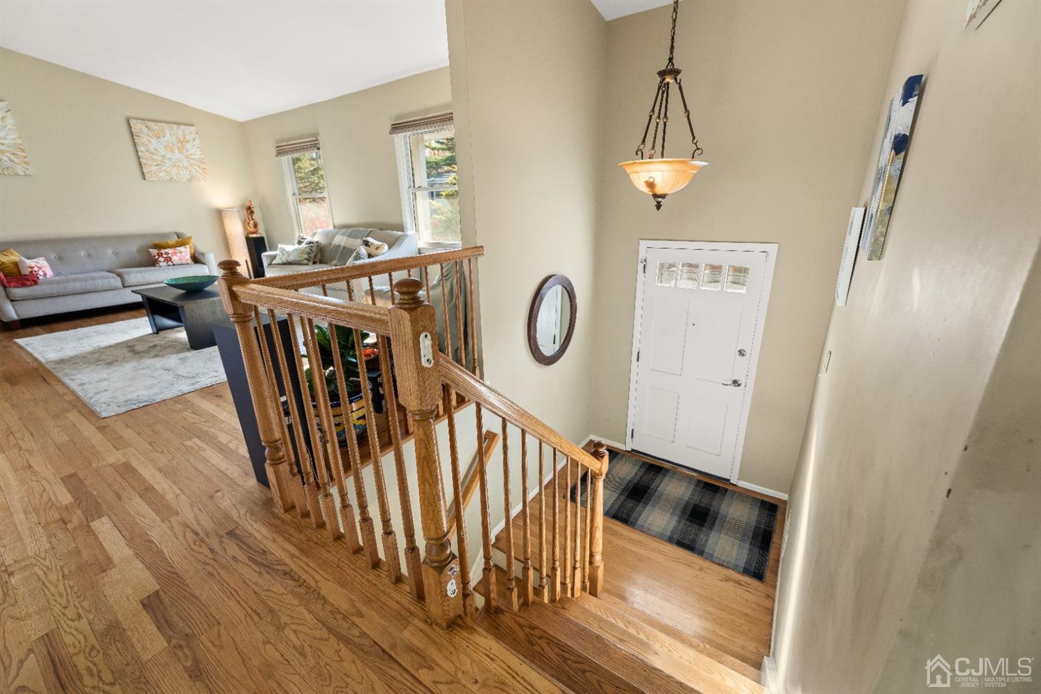 50 Wilk Road Edison, NJ 08837 - Photo 6 of 27 a view of a livingroom with furniture wooden floor windows and a chandelier