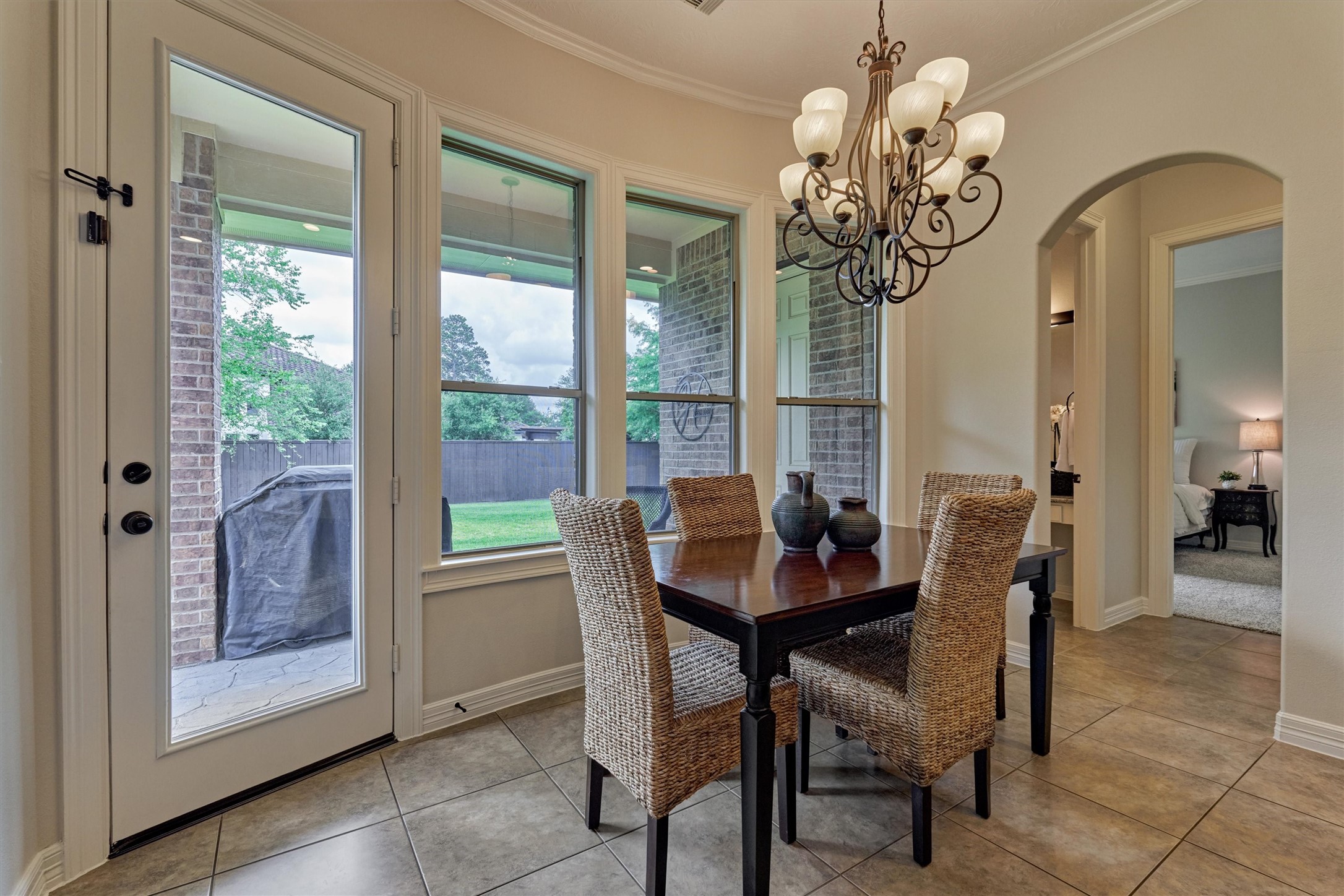 67 South Sage Sparrow Circle Spring, TX 77389 - Photo 27 of 49 a dining room with furniture a chandelier and wooden floor
