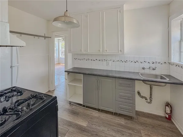 a kitchen with a stove and a sink