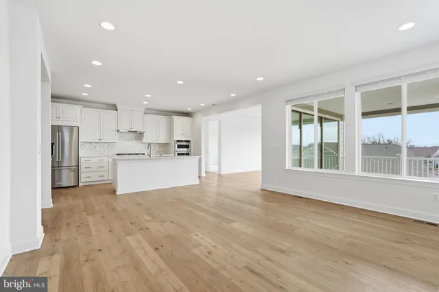 a view of kitchen with wooden floor and window