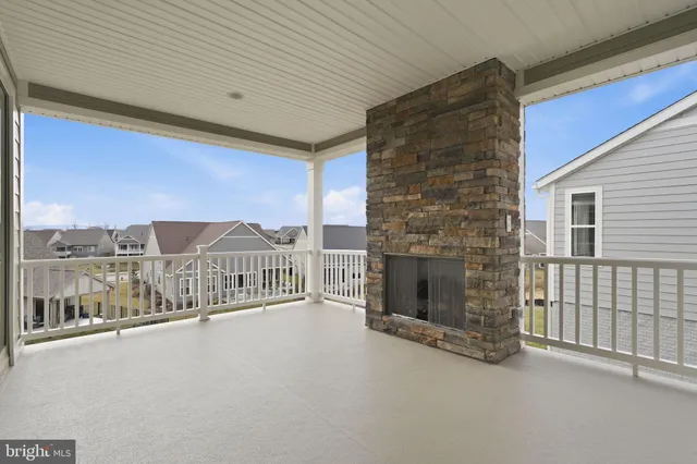 a view of a balcony with a ceiling fan