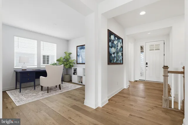 a workspace with furniture window and wooden floor