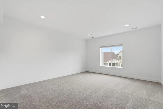 an empty room with a empty space and window