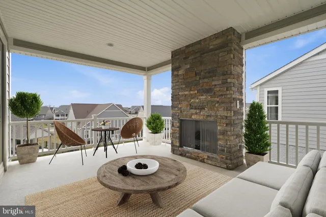 a outdoor space with furniture and a fireplace