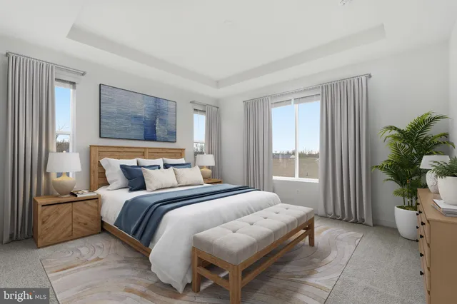 a bedroom with bed and a window