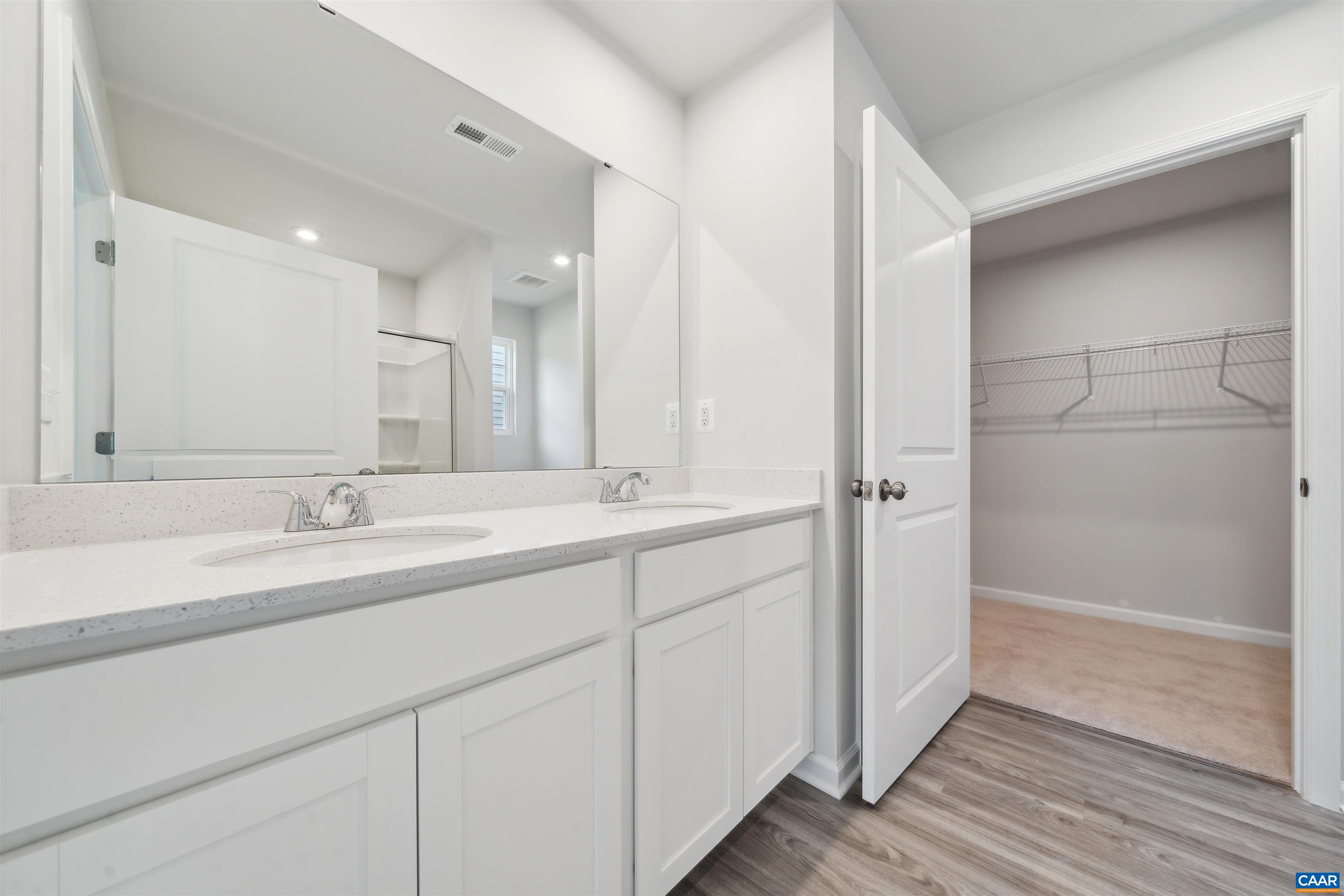 348 Trailfork Road Barboursville, VA 22923 - Photo 15 of 40 a bathroom with a double vanity sink and mirror