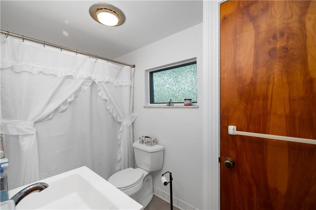 411 Harmony Road Baden, PA 15005 - Photo 17 of 25 a bathroom with a sink and toilet