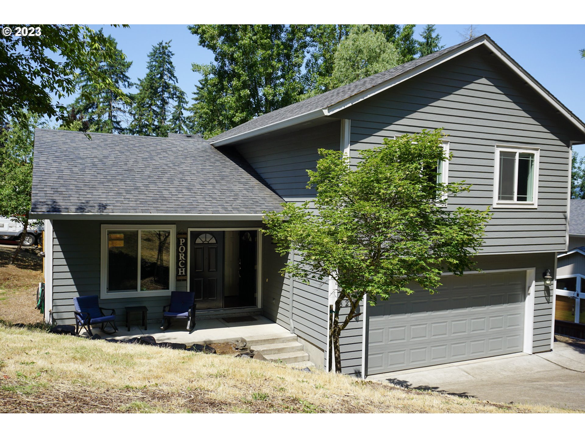 828 South 73rd Street Springfield, OR 97478 - Photo 23 of 23 a house that has a tree in front of it