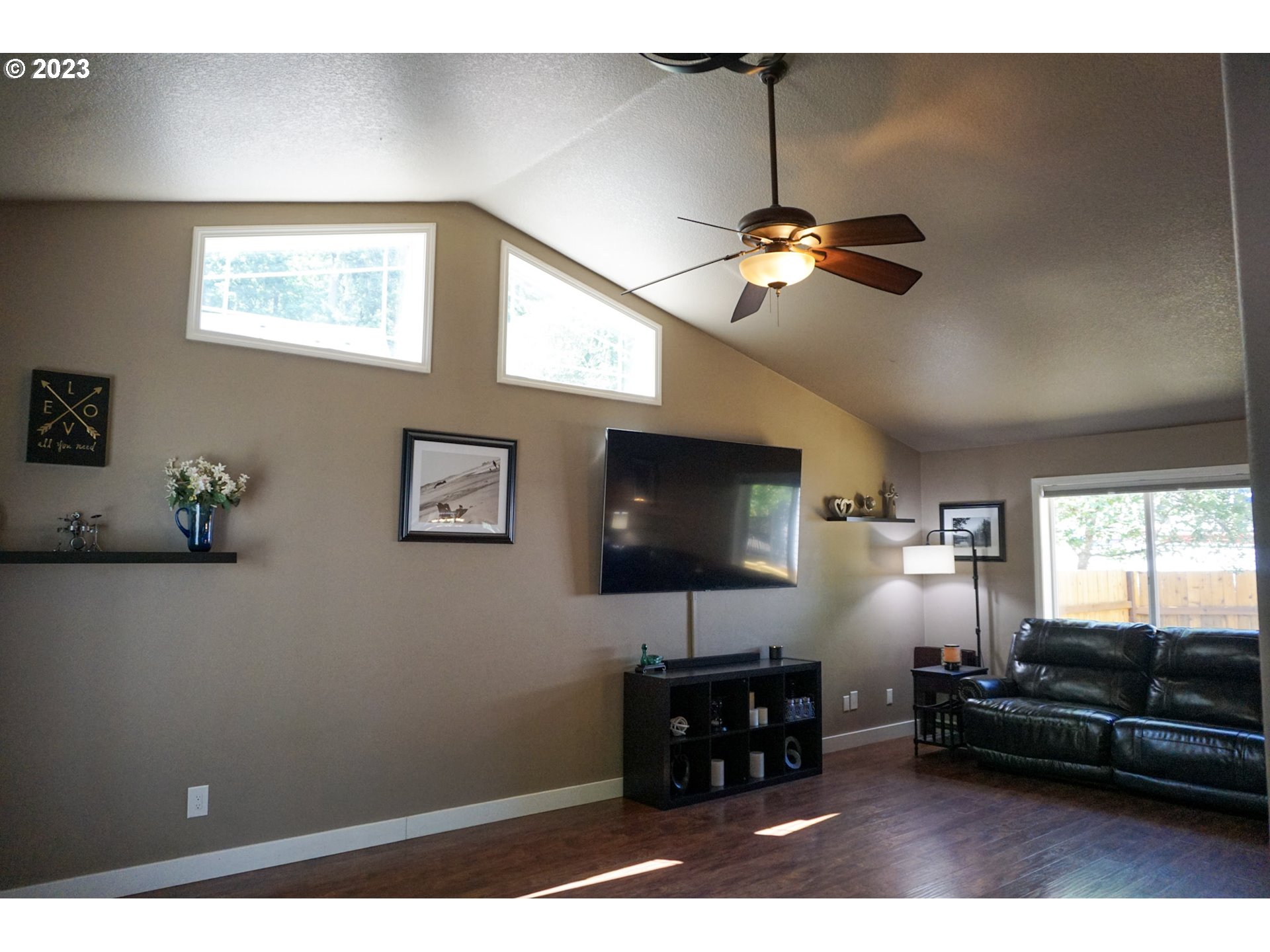828 South 73rd Street Springfield, OR 97478 - Photo 10 of 23 a living room with furniture and a flat screen tv