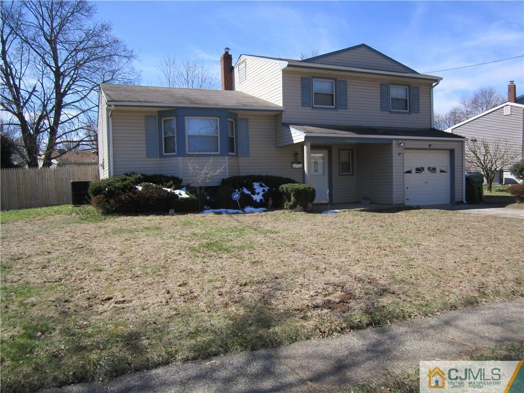 26 Outcalt Road Edison, NJ 08817 - Photo 1 of 23 a front view of a house with a yard