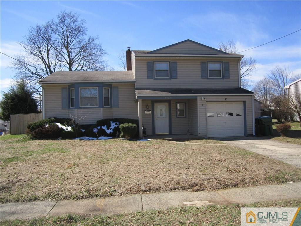 26 Outcalt Road Edison, NJ 08817 - Photo 2 of 23 a front view of a house with a yard