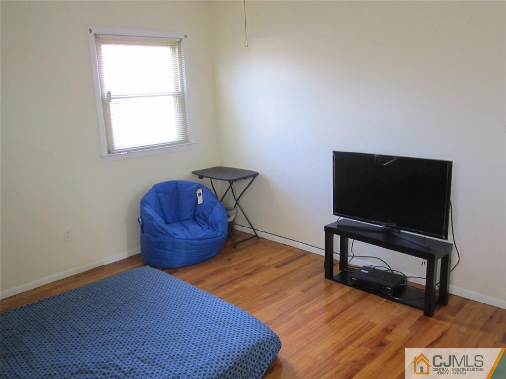 26 Outcalt Road Edison, NJ 08817 - Photo 11 of 23 a bedroom with a bed and a television