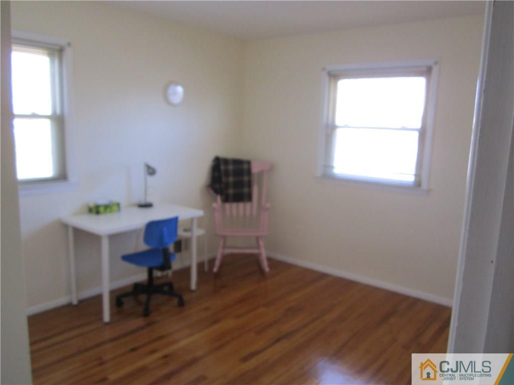26 Outcalt Road Edison, NJ 08817 - Photo 12 of 23 a view of a workspace with furniture and a window