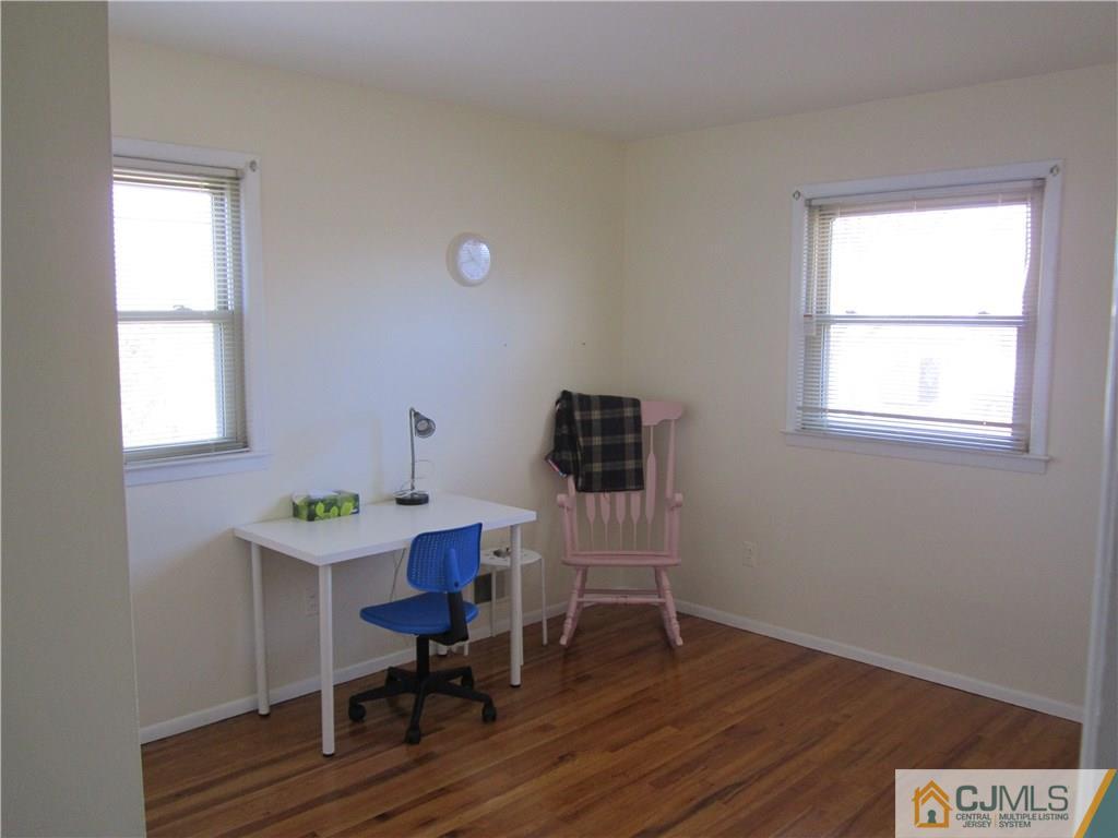 26 Outcalt Road Edison, NJ 08817 - Photo 14 of 23 a workspace with furniture hardwood and a window