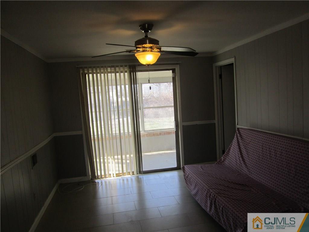 26 Outcalt Road Edison, NJ 08817 - Photo 15 of 23 a view of empty room with wooden floor and fan