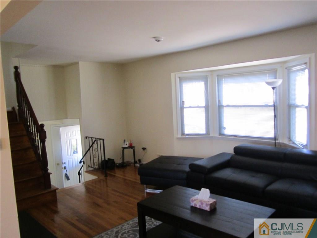 26 Outcalt Road Edison, NJ 08817 - Photo 3 of 23 a living room with furniture and a window