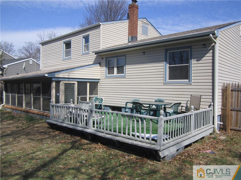 26 Outcalt Road Edison, NJ 08817 - Photo 21 of 23 a view of a house with a wooden deck