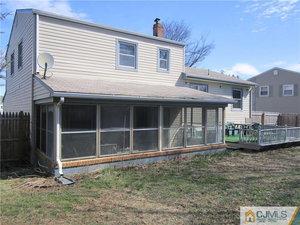 26 Outcalt Road Edison, NJ 08817 - Photo 22 of 23 a front view of a house with a yard and garage