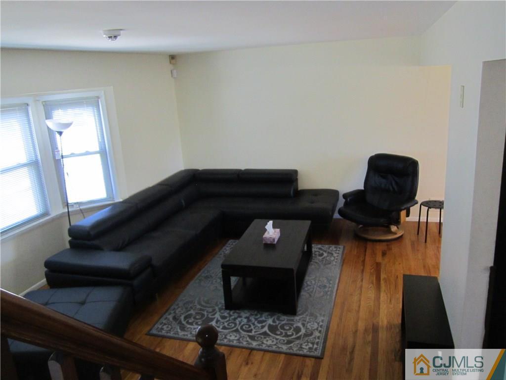 26 Outcalt Road Edison, NJ 08817 - Photo 8 of 23 a living room with furniture and wooden floor