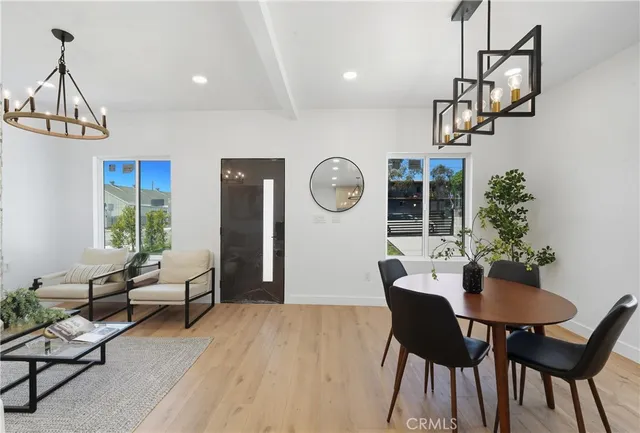 a view of a dining room with furniture window and wooden floor