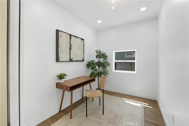 a room with furniture and a potted plant