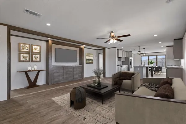 a living room with furniture and wooden floor