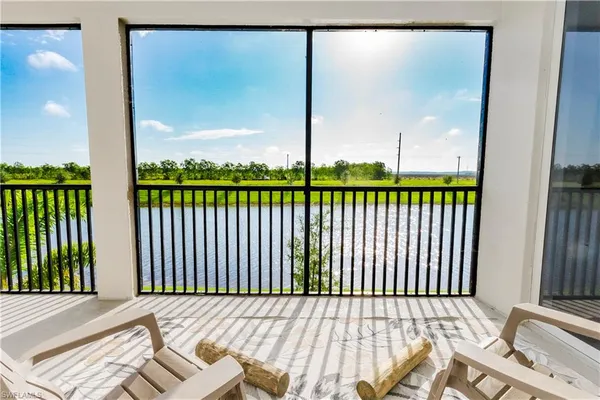 a view of a balcony with a yard