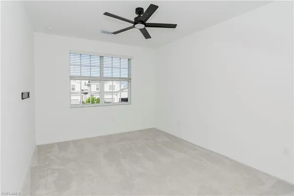 a bathroom with a granite countertop sink a toilet and bathtub