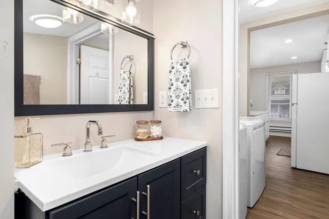 a bathroom with a sink and a mirror