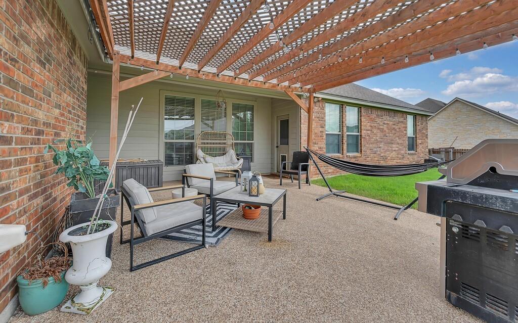 550 Hunton Lane Robinson, TX 76706 - Photo 29 of 35 View of patio with a pergola, an outdoor living space, and grilling area