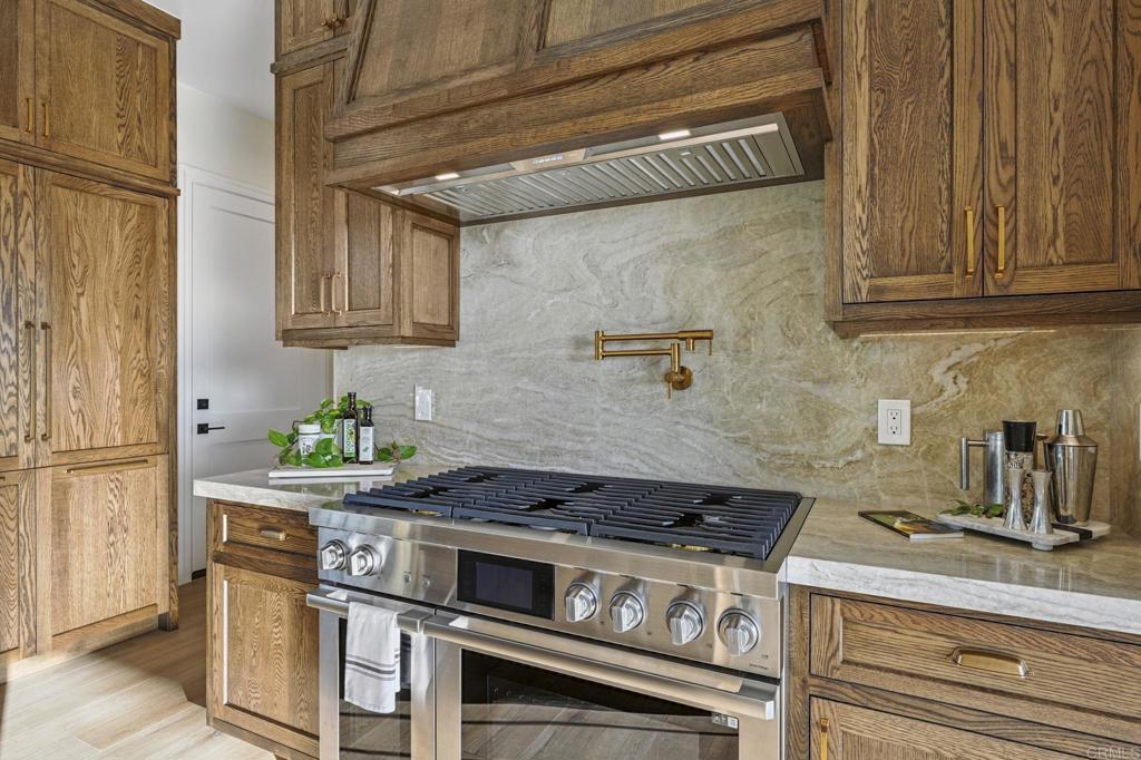 662 Lower Springs Road Fallbrook, CA 92028 - Photo 12 of 72 a kitchen with stainless steel appliances granite countertop a stove and a refrigerator