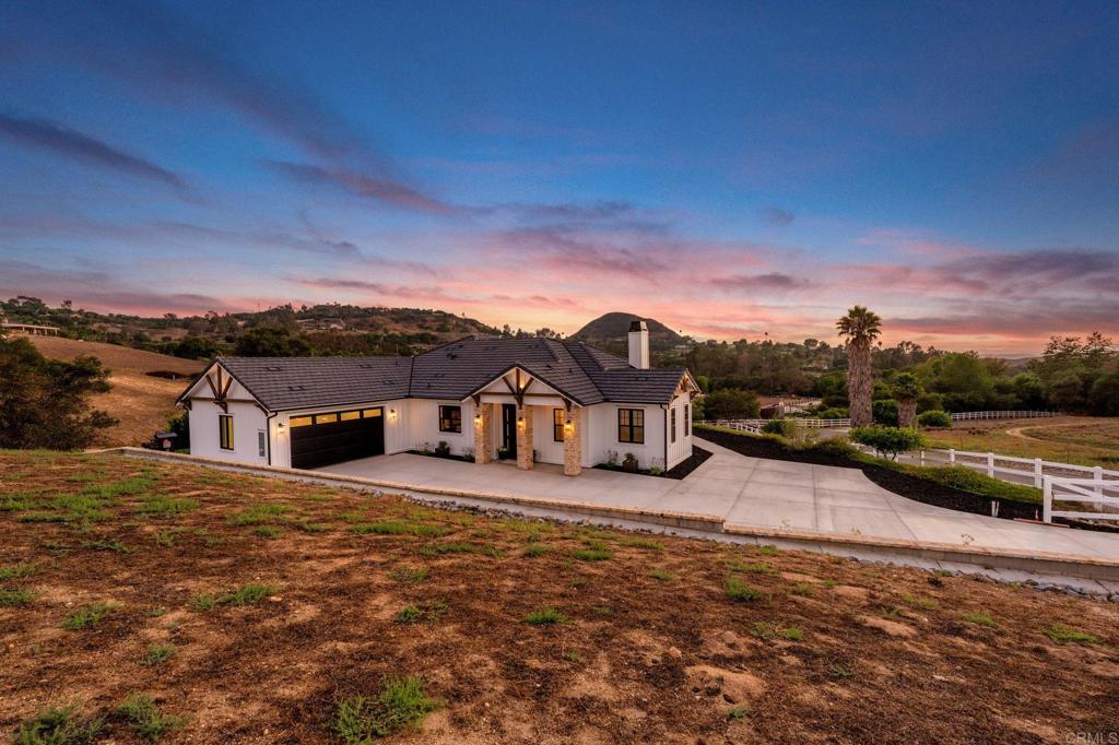 662 Lower Springs Road Fallbrook, CA 92028 - Photo 2 of 72 a view of a house with a big yard