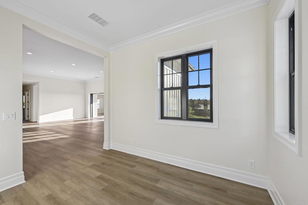 662 Lower Springs Road Fallbrook, CA 92028 - Photo 25 of 72 an empty room with wooden floor and windows