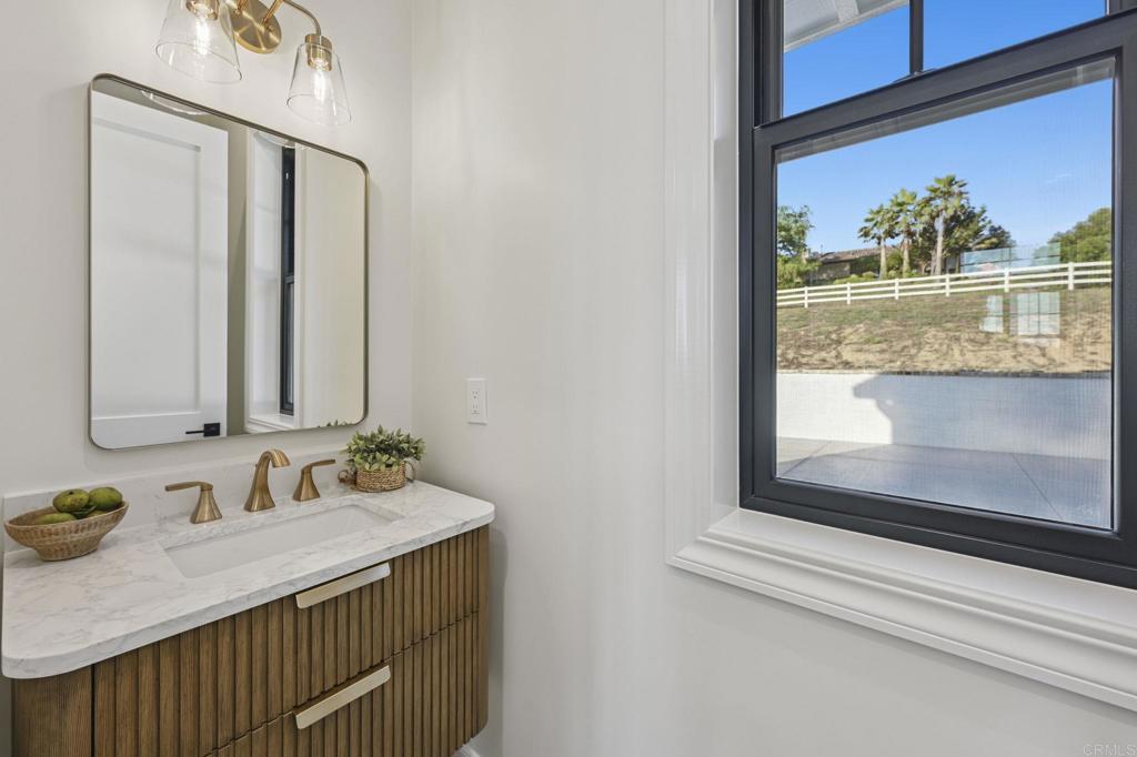 662 Lower Springs Road Fallbrook, CA 92028 - Photo 26 of 72 a bathroom with a sink and a mirror
