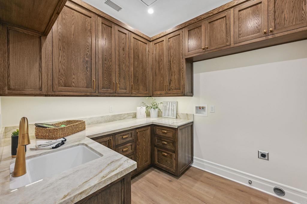 662 Lower Springs Road Fallbrook, CA 92028 - Photo 27 of 72 a kitchen with a sink cabinets and wooden floor