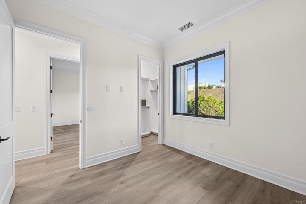 662 Lower Springs Road Fallbrook, CA 92028 - Photo 30 of 72 a view of an empty room with window and closet area