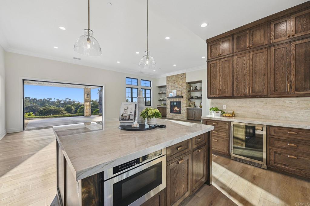 662 Lower Springs Road Fallbrook, CA 92028 - Photo 3 of 72 a kitchen with stainless steel appliances granite countertop a stove and a sink