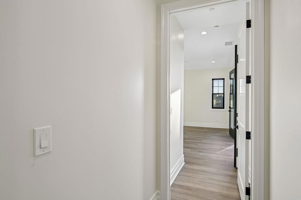 662 Lower Springs Road Fallbrook, CA 92028 - Photo 34 of 72 a view of a hallway with a wooden floor