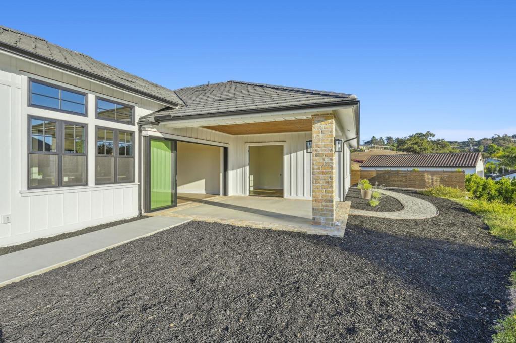 662 Lower Springs Road Fallbrook, CA 92028 - Photo 39 of 72 a view of a house with backyard and porch