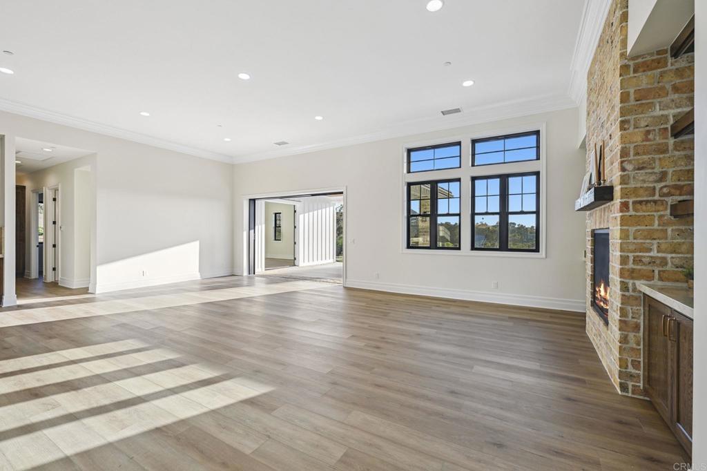 662 Lower Springs Road Fallbrook, CA 92028 - Photo 4 of 72 a view of an empty room with wooden floor and a window