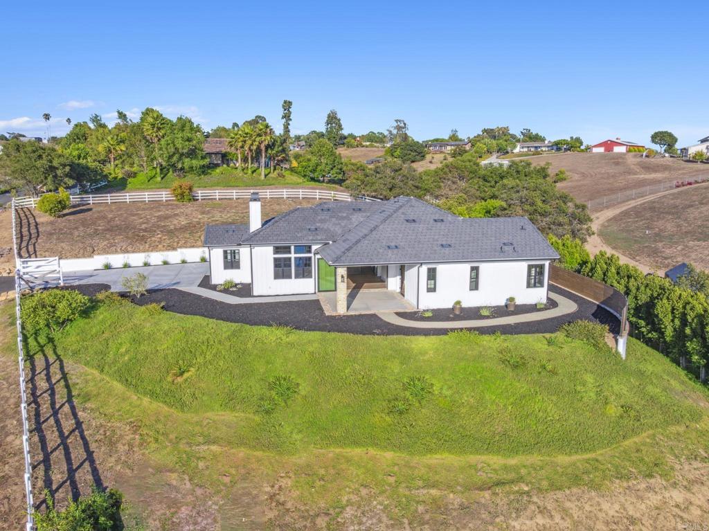 662 Lower Springs Road Fallbrook, CA 92028 - Photo 43 of 72 an aerial view of a house with swimming pool garden and mountain view