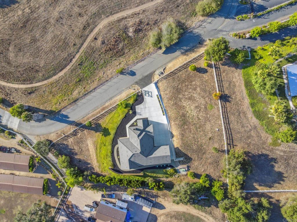 662 Lower Springs Road Fallbrook, CA 92028 - Photo 53 of 72 an aerial view of a house with a garden and a yard