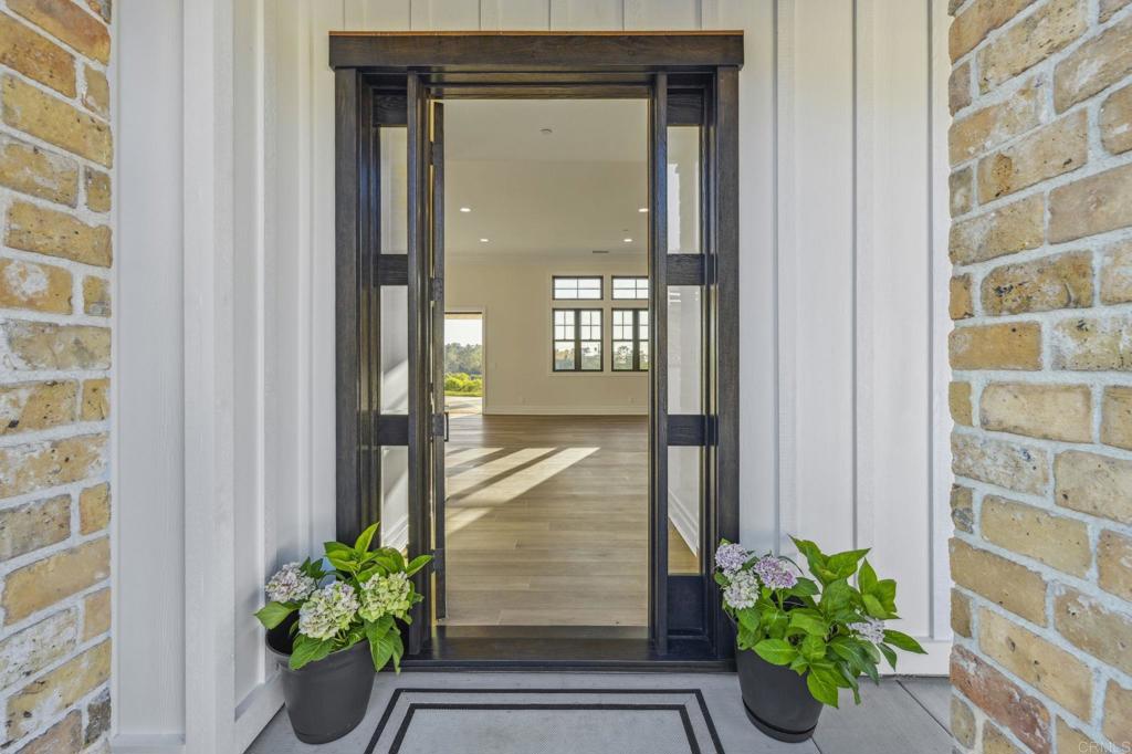 662 Lower Springs Road Fallbrook, CA 92028 - Photo 58 of 72 a potted plant sitting in front of a glass door