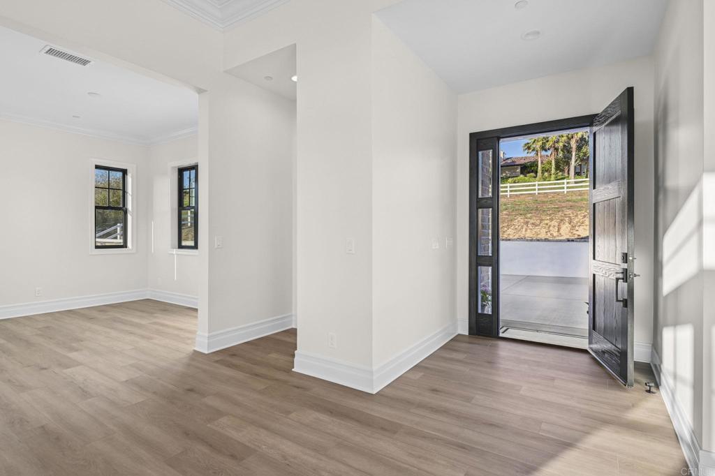 662 Lower Springs Road Fallbrook, CA 92028 - Photo 59 of 72 an empty room with wooden floor and windows