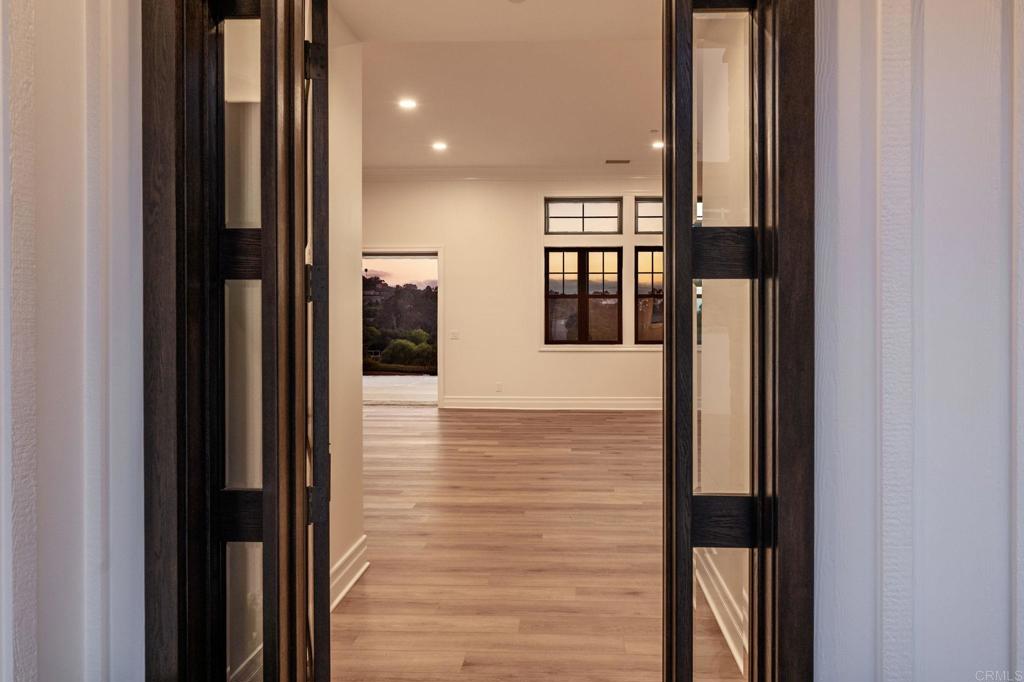 662 Lower Springs Road Fallbrook, CA 92028 - Photo 66 of 72 a view of a hallway with wooden floor and staircase