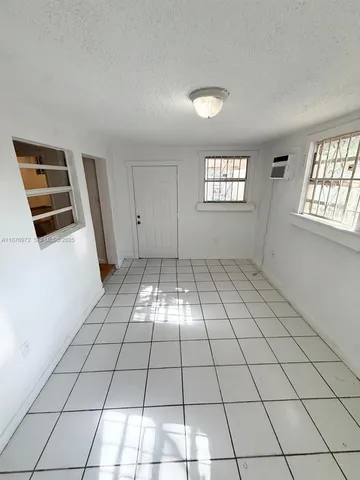 a view of an empty room and window