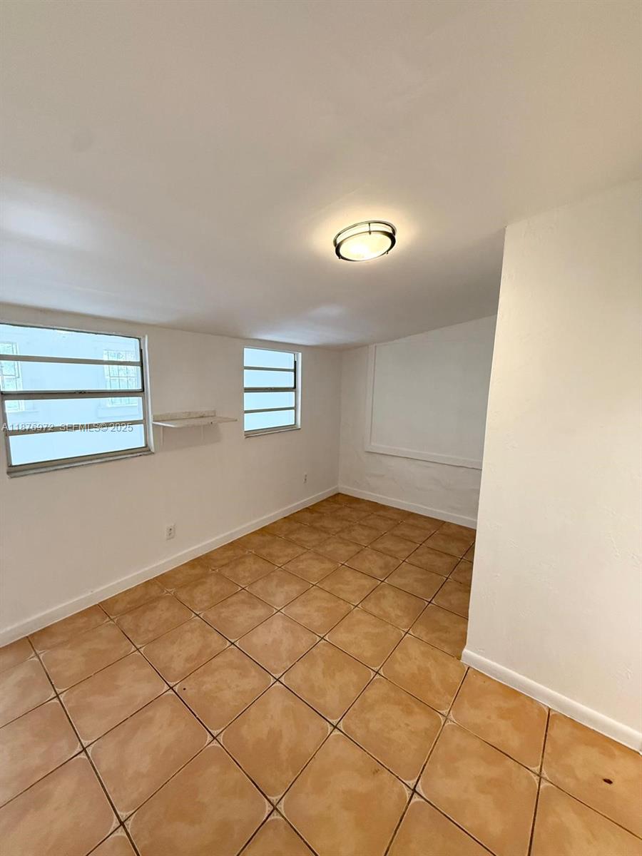 1340 Peri Street, Unit D Opa-Locka, FL 33054 - Photo 6 of 6 a view of empty room