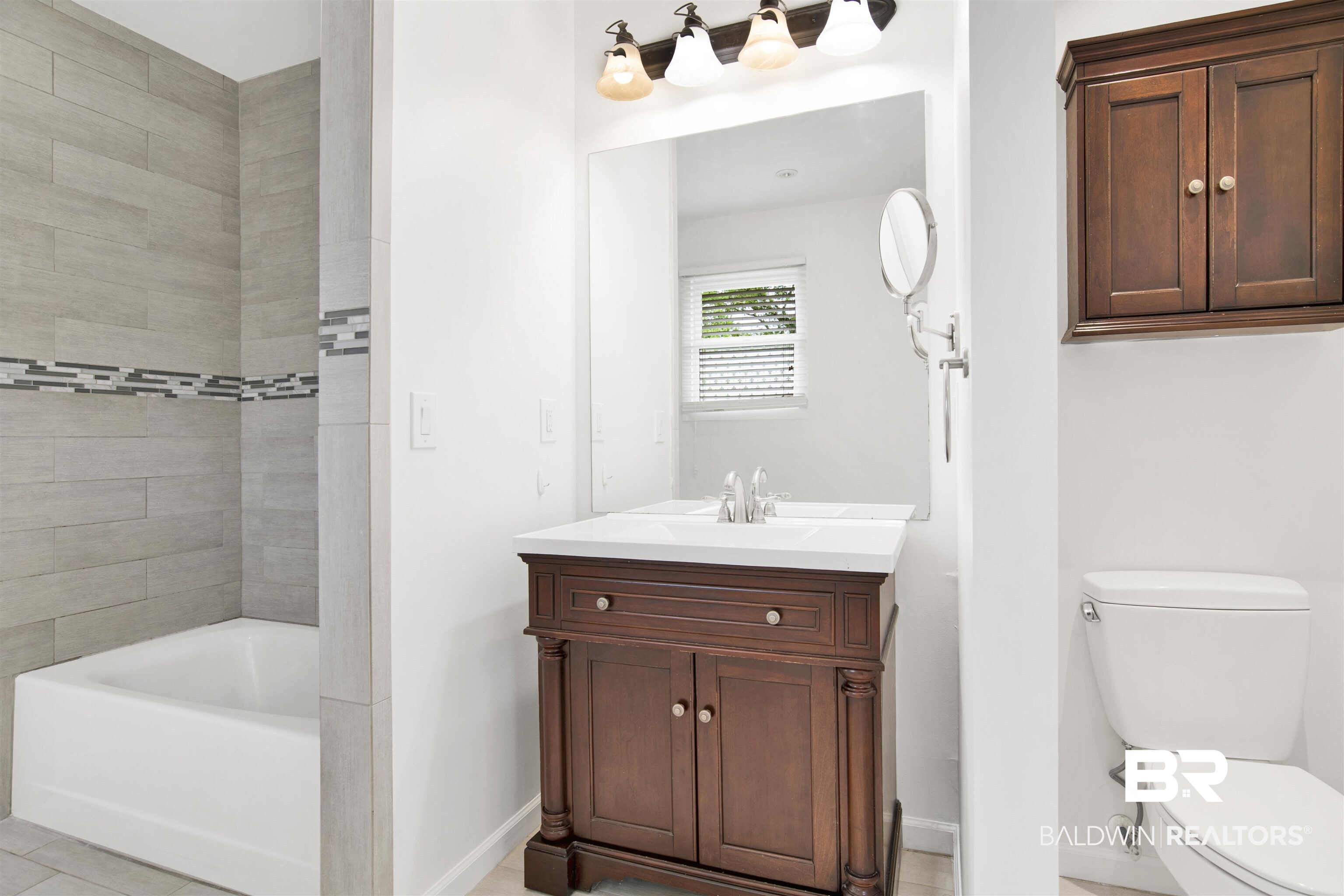 507 Holcombe Avenue Mobile, AL 36606 - Photo 27 of 28 Full bathroom featuring baseboards, toilet, and vanity